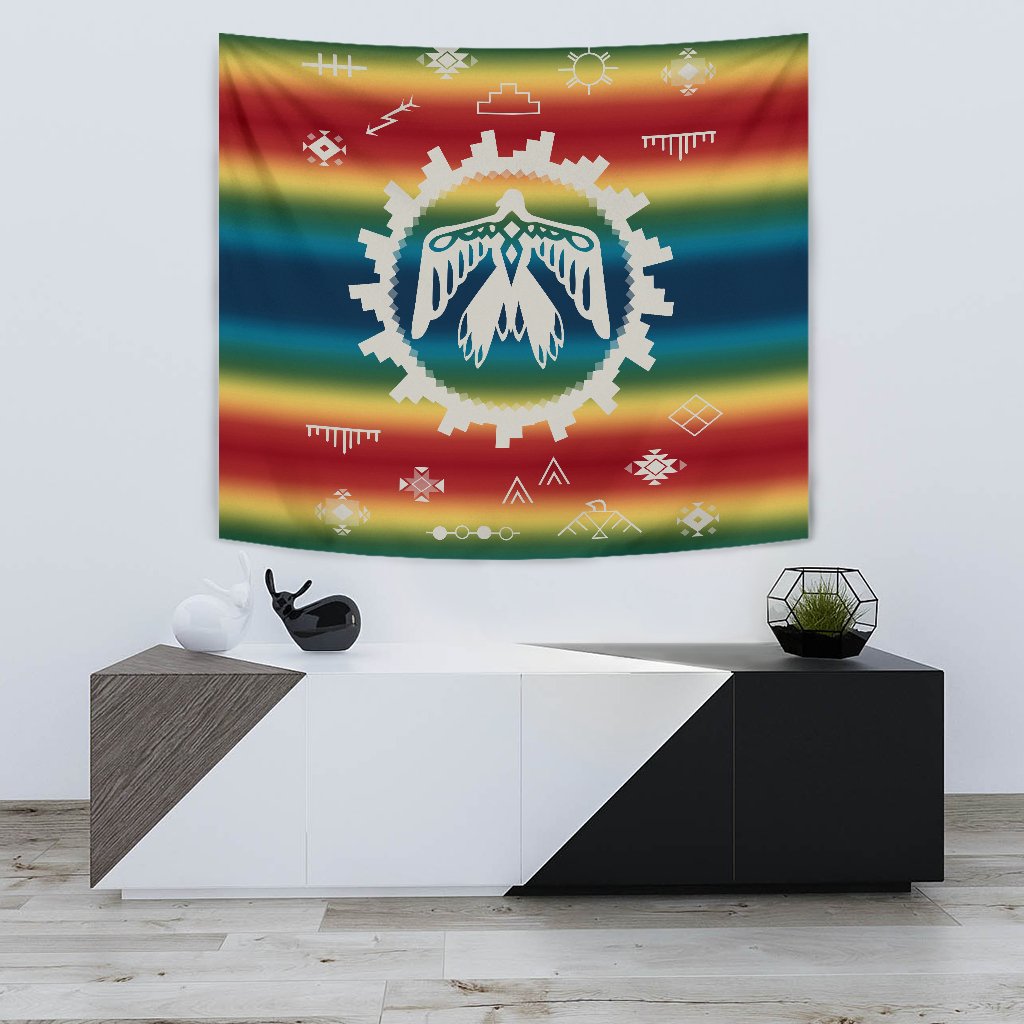 Colorful rainbow tapestry with central thunderbird and white feather motif, geometric icons
