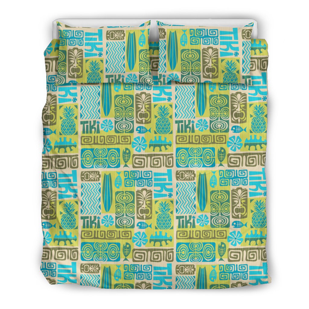 Multicolor tiki pattern duvet cover and pillows with Greek key borders and tropical icons