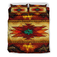 Colorful Native American symbol bedding set close view: red, gold, and teal geometric design