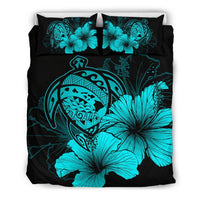 Turquoise hibiscus and tribal print bedding set on black with matching pillowcases