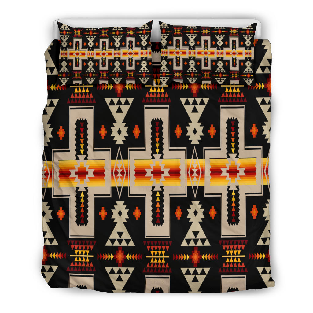 Front view: black duvet cover with bold multicolor geometric Native-inspired motifs and 2 pillows