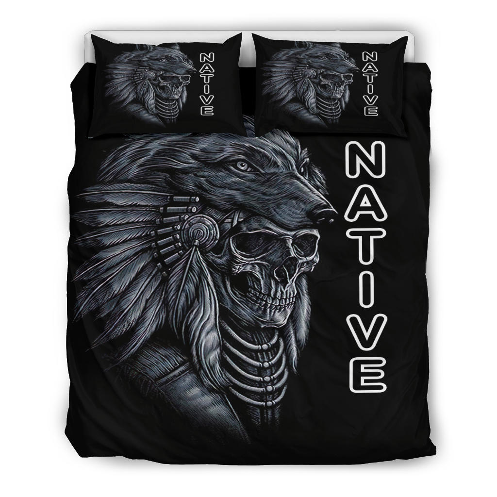 Two black throw pillows and duvet with Native skull horse head and feather graphic