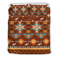 Bedding set featuring folded pillows; brown geometric pattern with turquoise triangles and birds