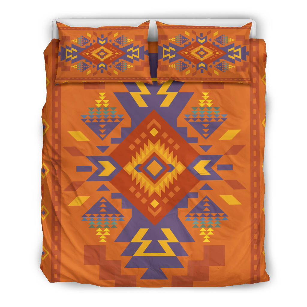 Multicolor geometric bedding set with two orange pillow shams featuring diamond and arrow motifs