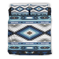 Folded bedding set showing blue, white, and black tribal geometric patterns on cover.