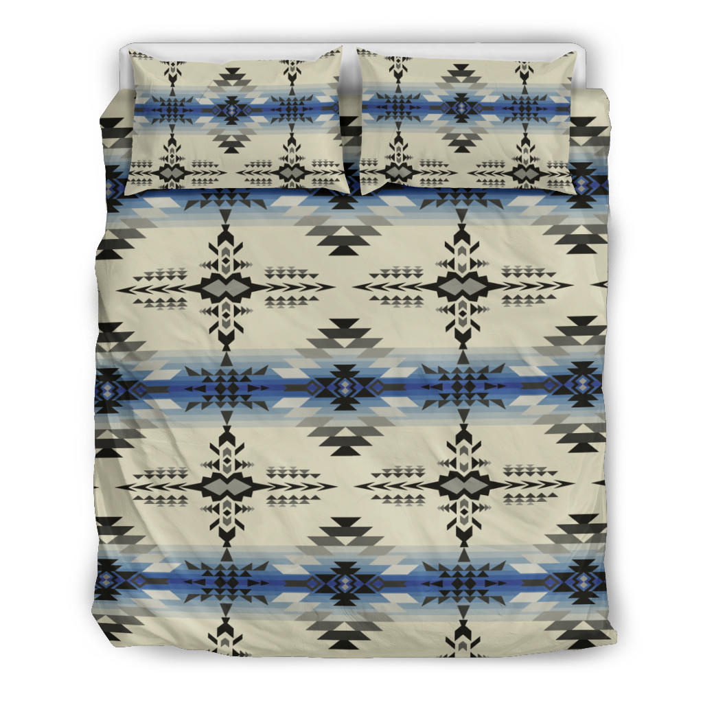 Bedding set with cream base and repeating black, blue geometric motifs; two pillowcases shown