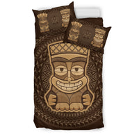 Brown bedding set with two tiki character pillows and matching tribal mask comforter