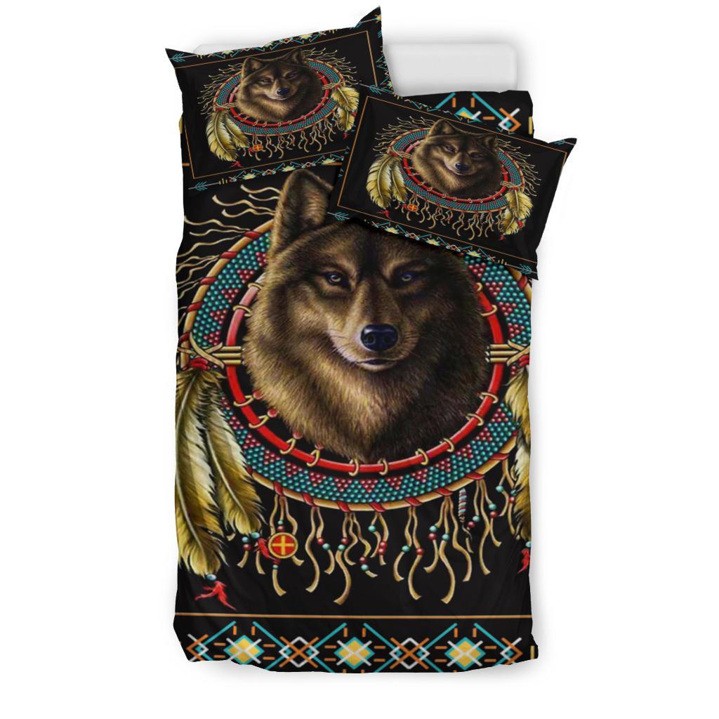 Front view of black duvet and shams featuring brown wolf face, dreamcatcher circle, and tassels