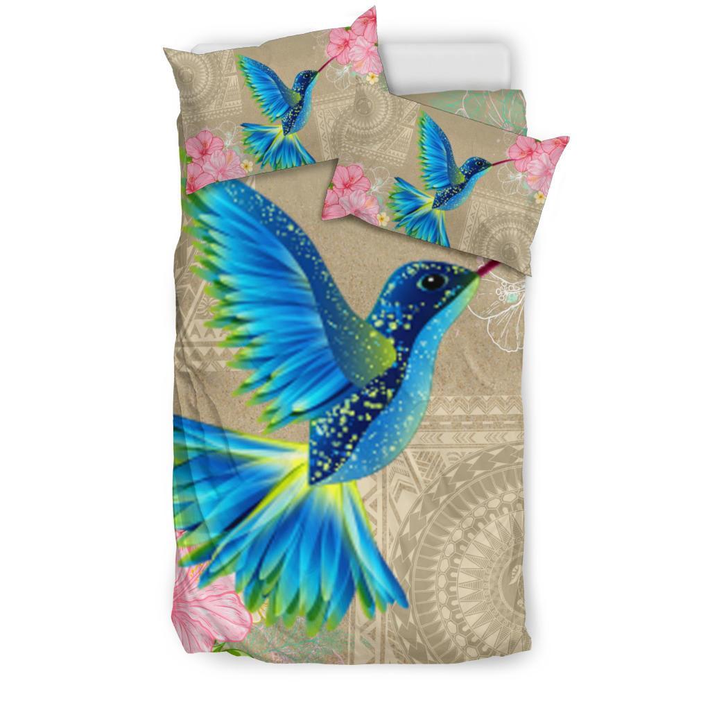 Beige Hawaiian bedding set with blue birds and pink flowers; two matching pillowcases