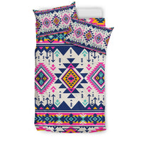 Multicolor Native-style bedding set with geometric diamond/arrow pattern and pink accents