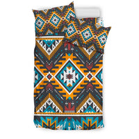 Multicolor Aztec-style geometric bedding set with matching pillow and bold diamond patterns