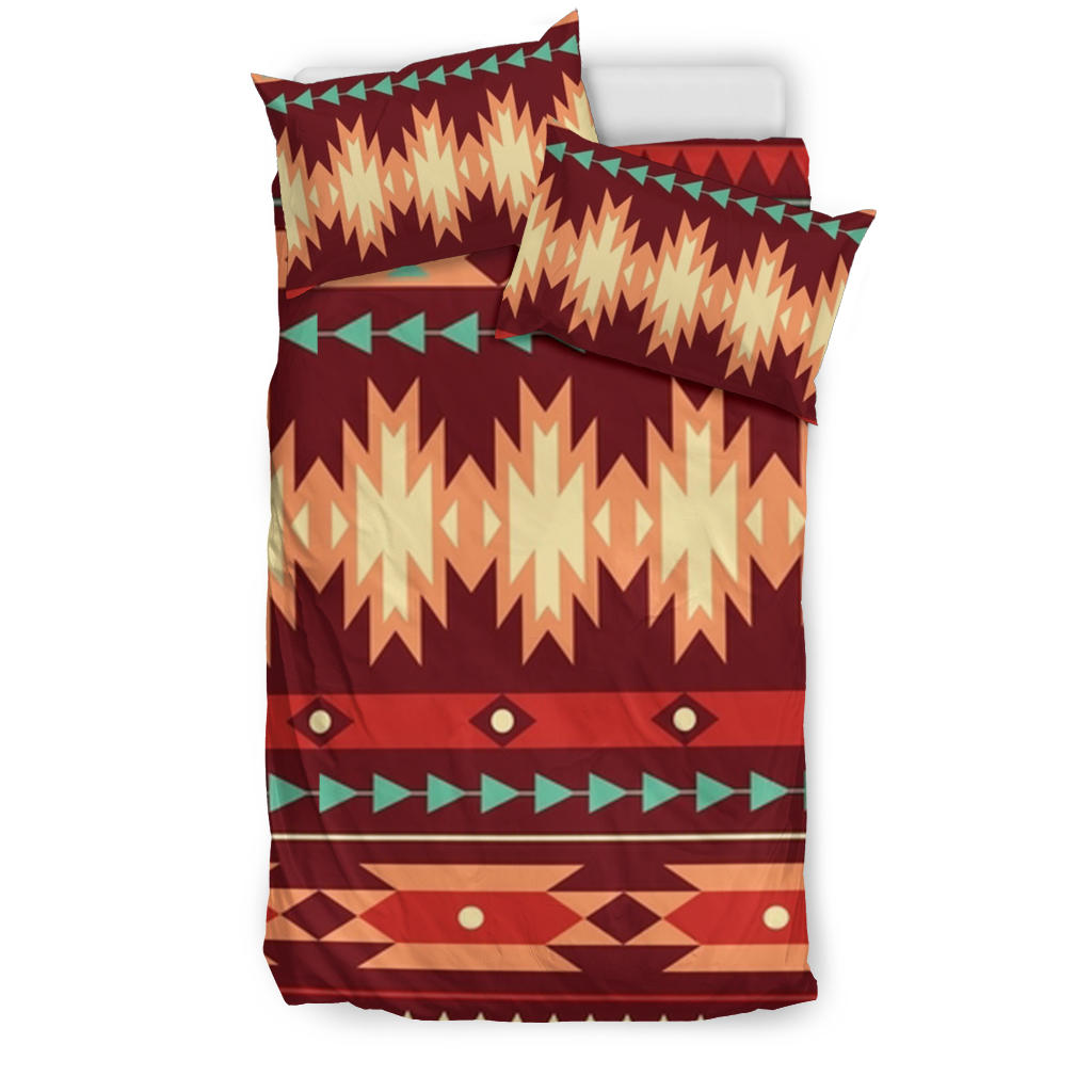 Red geometric tribal bedding set with zigzag and diamond patterns, includes pillowcases