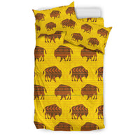 Yellow bedding set with repeating bison vector pattern on duvet and pillowcase