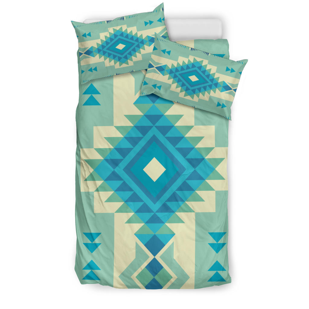 Patterned bedding set with teal base and blue multicolor geometric diamond medallion