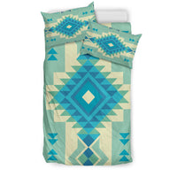 Patterned bedding set with teal base and blue multicolor geometric diamond medallion