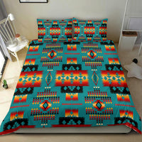 Multicolor Native Tribes bedding set with turquoise, red, and yellow geometric motif layout