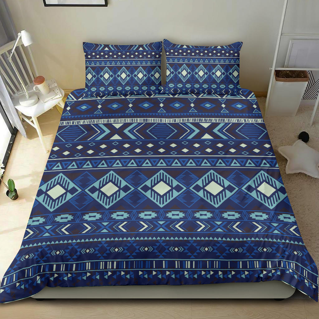 Navy geometric bedding set with matching pillow shams; teal and cream tribal stripes