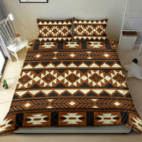Brown Native American bedding set with geometric pattern, laid out on bed