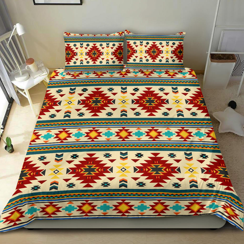 Multicolor southwest bedding set laid on bed with two shams and matching comforter