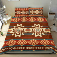 Native American-inspired red comforter with geometric diamond bands and matching pillows