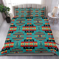 Native-style bedding set with teal background and multicolor geometric motifs