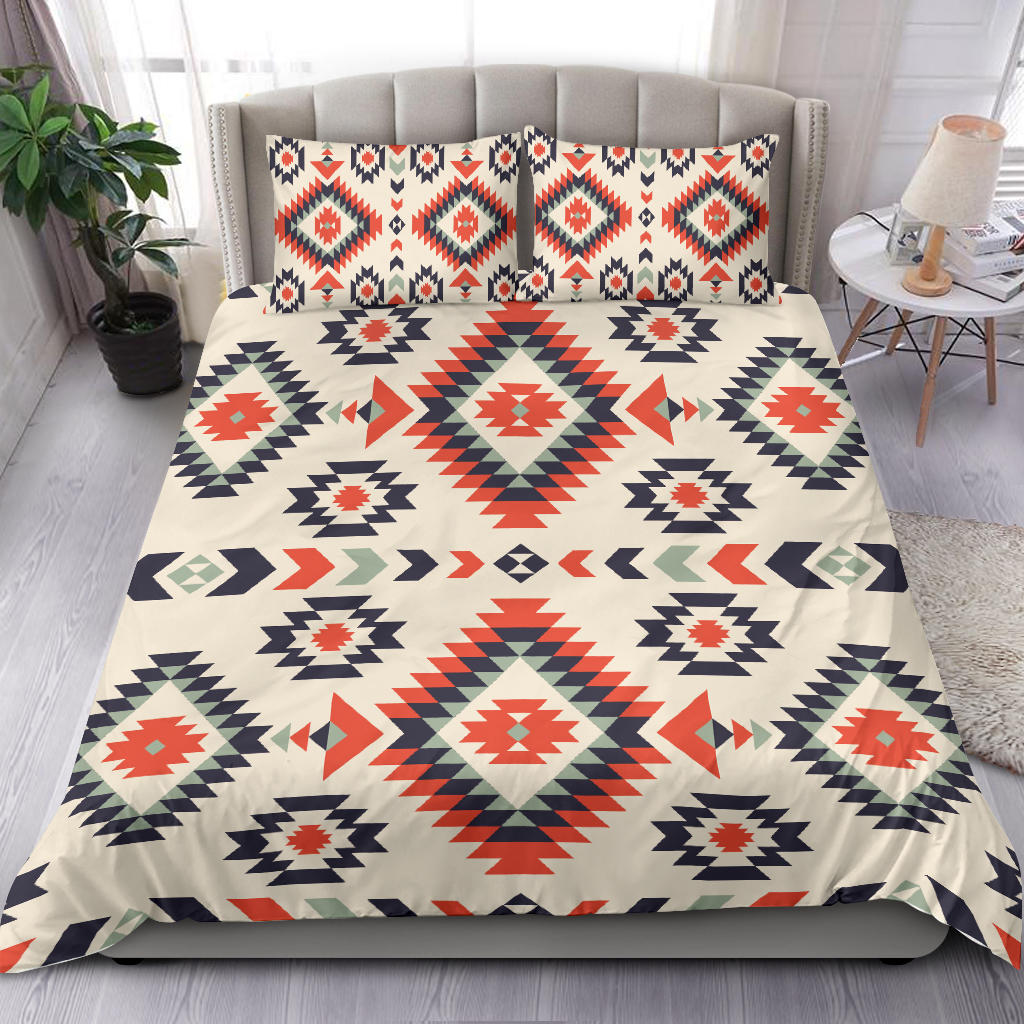 Cream duvet with red, navy, and green geometric patterns and coordinated pillowcases