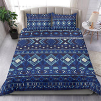 Navy patterned comforter set with pillow shams; teal, cream diamond blocks and borders