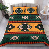 Geometric bedding set with bold Aztec medallion center and two matching pillowcases