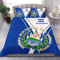 Blue & white El Salvador duvet set with emblem, text, and two matching pillows