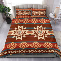 Red geometric bedding set with two pillow covers; diamond and star motifs in blue and cream