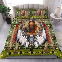Green chief bedding set with comforter and pillowcases, multicolor geometric accents and feathers