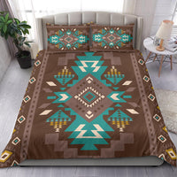Bedding set with pillows: brown cover featuring teal center diamond and geometric tree motifs
