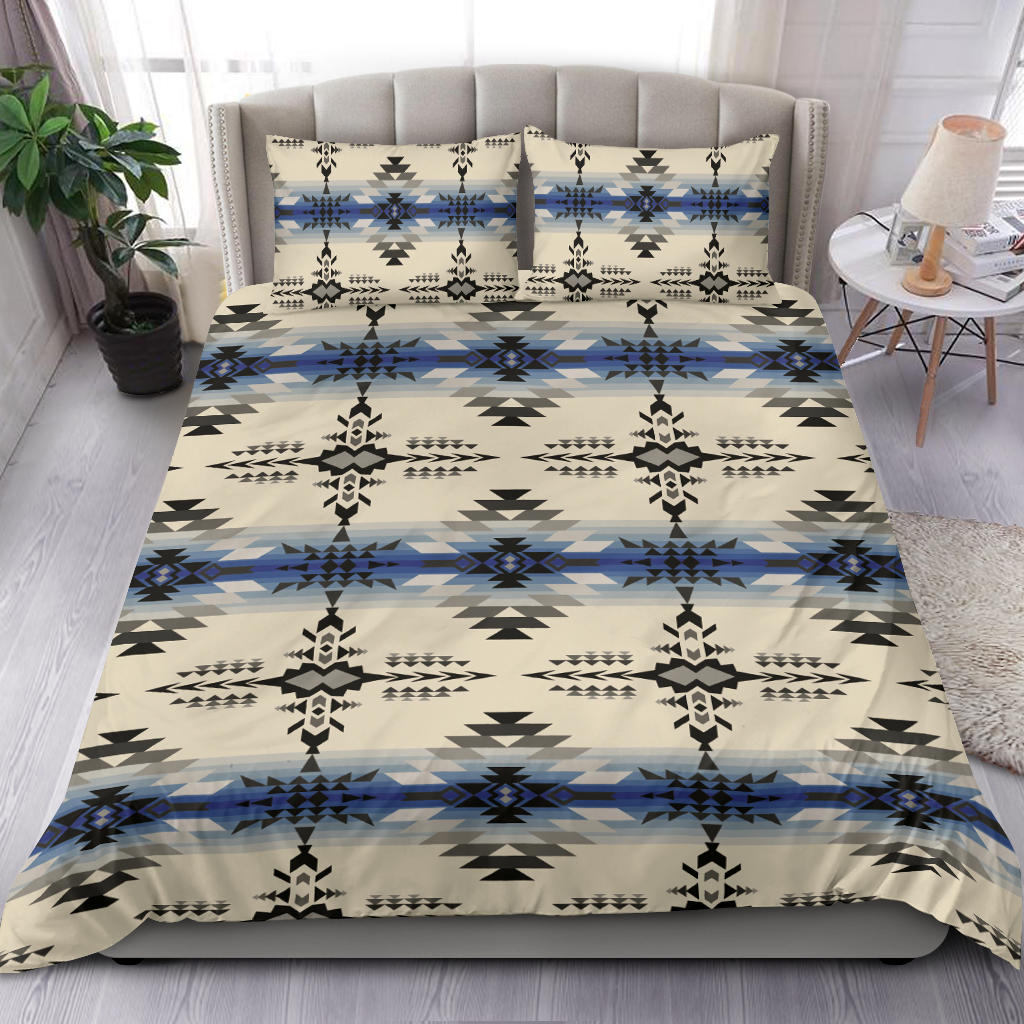 Cream bedding set featuring black and blue geometric print; includes pillowcases and comforter