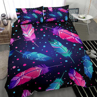 Feather and polka-dot comforter with two square pillowcases, pink and blue accents