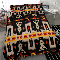 Black geometric bedding set with multicolor crosses, triangles, and arrow pattern