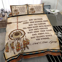 Close-up bedding view: dreamcatcher emblem, colorful feathers, and “May the Stars” quote