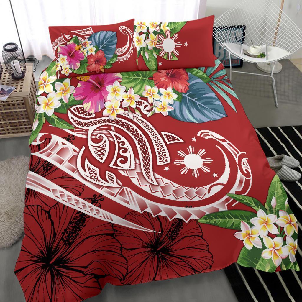 Red tropical duvet cover with hibiscus blossoms and leaf pattern; two pillow shams