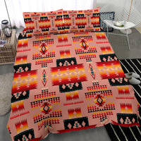 Tan tribal bedding cover with colorful geometric repeat, arrows, and framed motif blocks