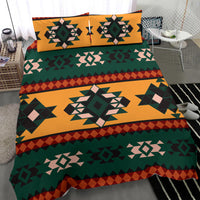 Aztec geometric bedding set with green, orange, and dark diamond patterns
