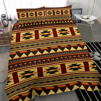 Close angle of multicolor tribal geometric bedding set with patterned comforter panels