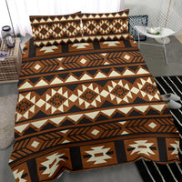 Close view of brown Native American bedding with multicolor diamond and stripe print