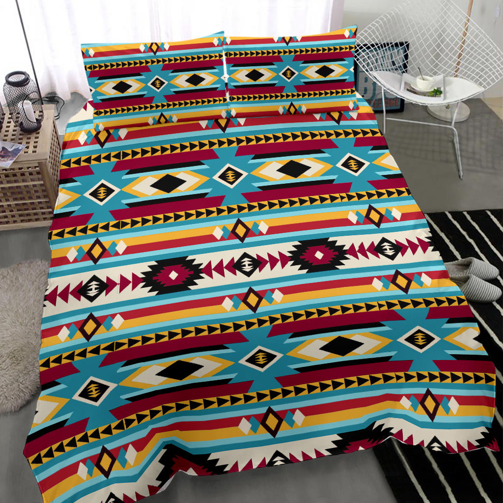 Bedding set with blue/red multicolor geometric tribal print on comforter, corner view