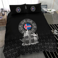Close view of black duvet featuring ornate Iceland coat of arms and tassel border