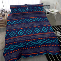 Diagonal view of teal, navy, and orange geometric bedding set with pillow cover