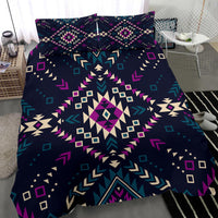 Dark tribal bedding set close-up with multicolor geometric diamond and arrow patterns on comforter