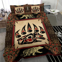 Close-up bedding set showing tribal bear-face duvet with two pillow shams and bear silhouette