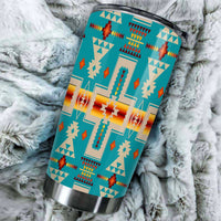 20oz turquoise tumbler with multicolor native geometric design; close-up angled view