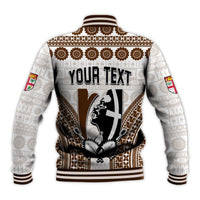 White baseball jacket with brown tapa pattern, ribbed collar/cuffs, back text graphic