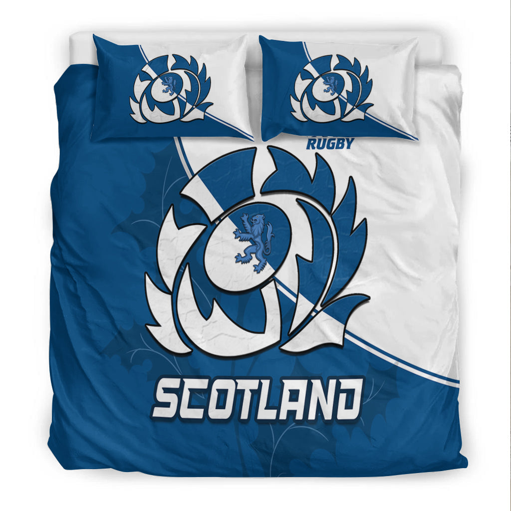 Blue and white bedding set with crest circle, 'SCOTLAND' wordmark, and two matching pillows