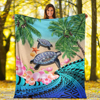 Blue tropical blanket with sea turtles, palm trees, orchids, and ocean pattern